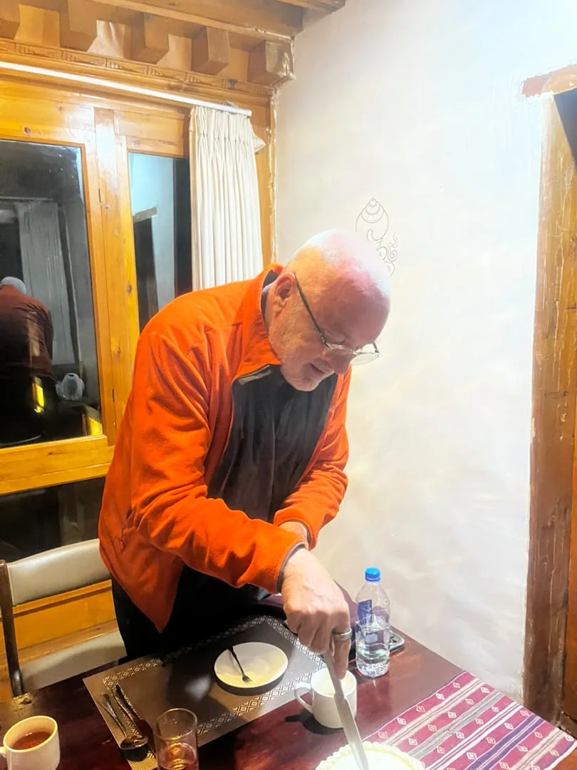 Richard celebrating his birthday in a traditional Bhutanese home