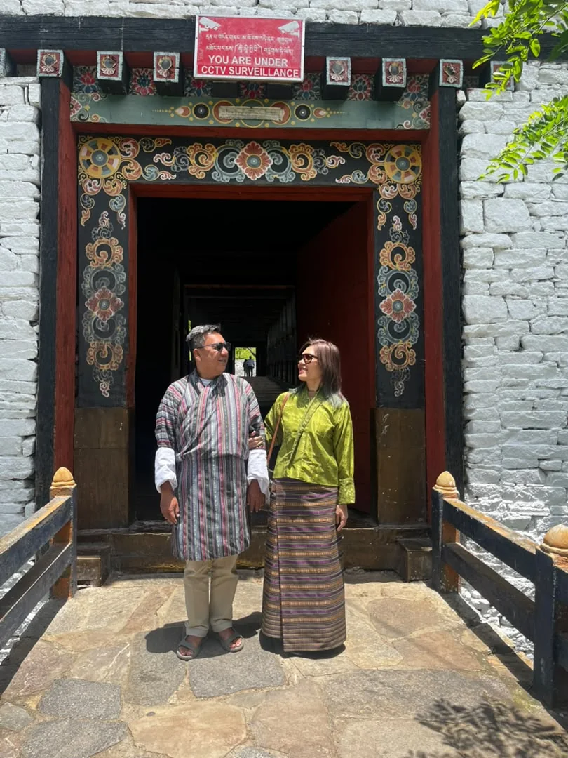 Ruth and Raymond wearing traditional Bhutanese dress