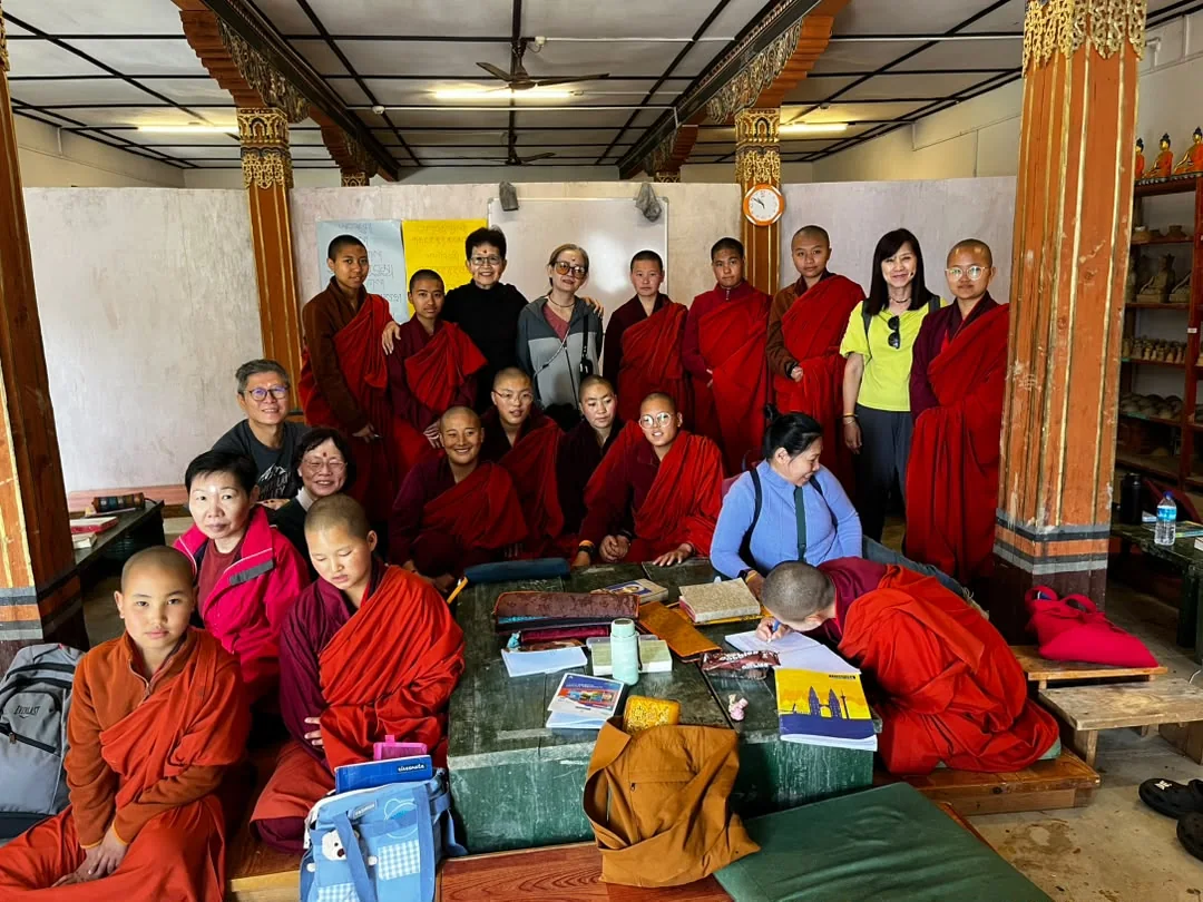 Singaporean travellers meeting young Buddhist monks